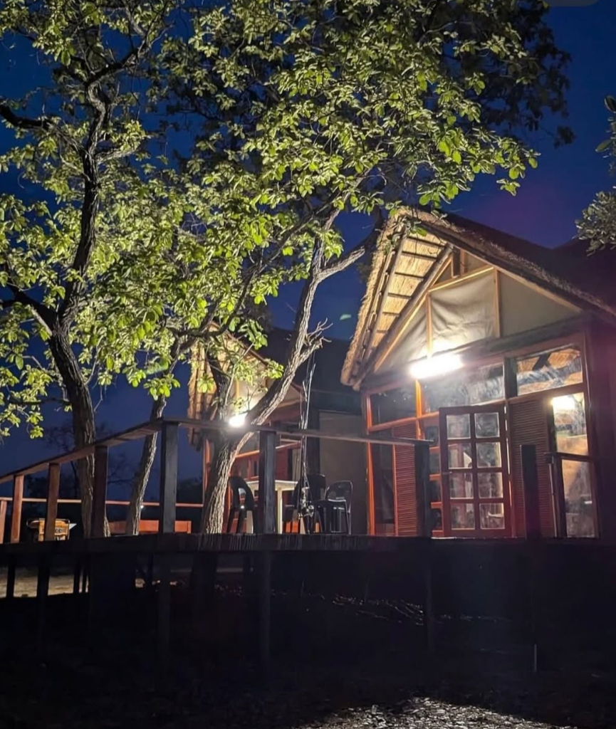 Luxury safari chalet at night